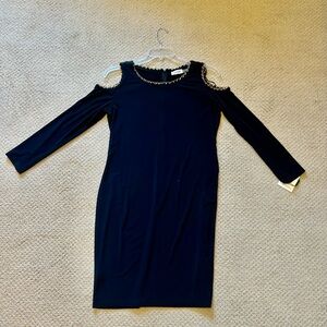NWT black Calvin Klein dress, size 12. Gold chain accent.